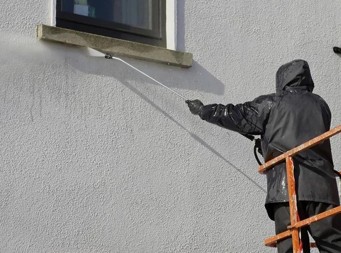 application d'un traitement hydrofuge sur façade à Mantes la Ville